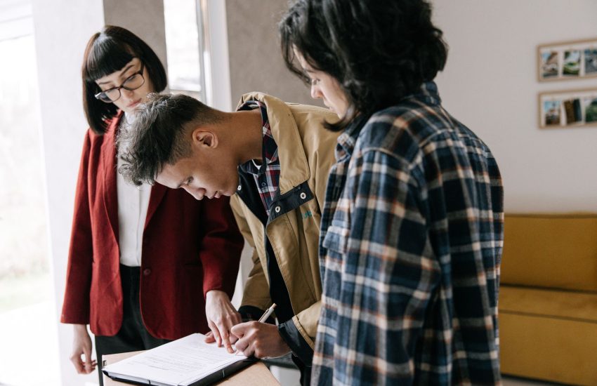 Homeowner reviewing and signing home equity loan papers