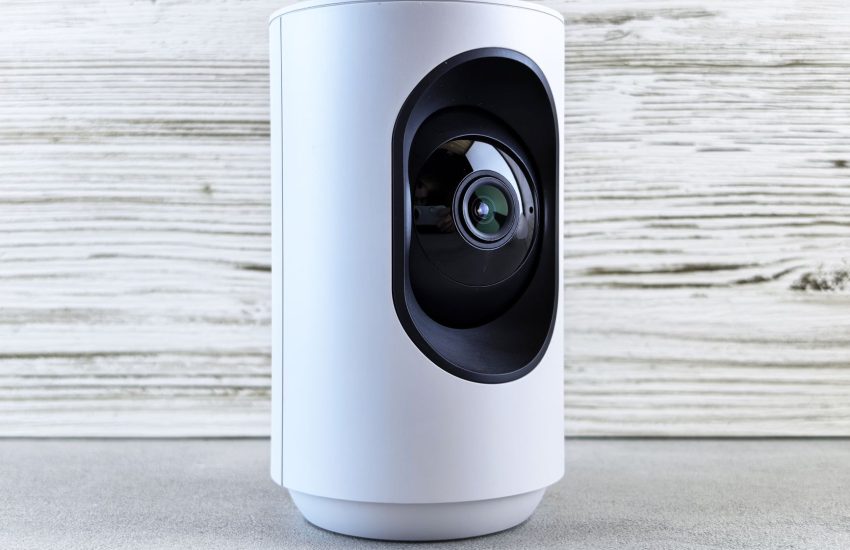 Security camera mounted near a home front door for burglary prevention