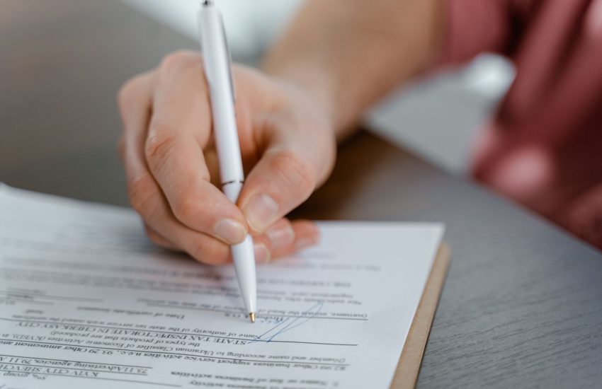 Home warranty contract and coverage paperwork on table